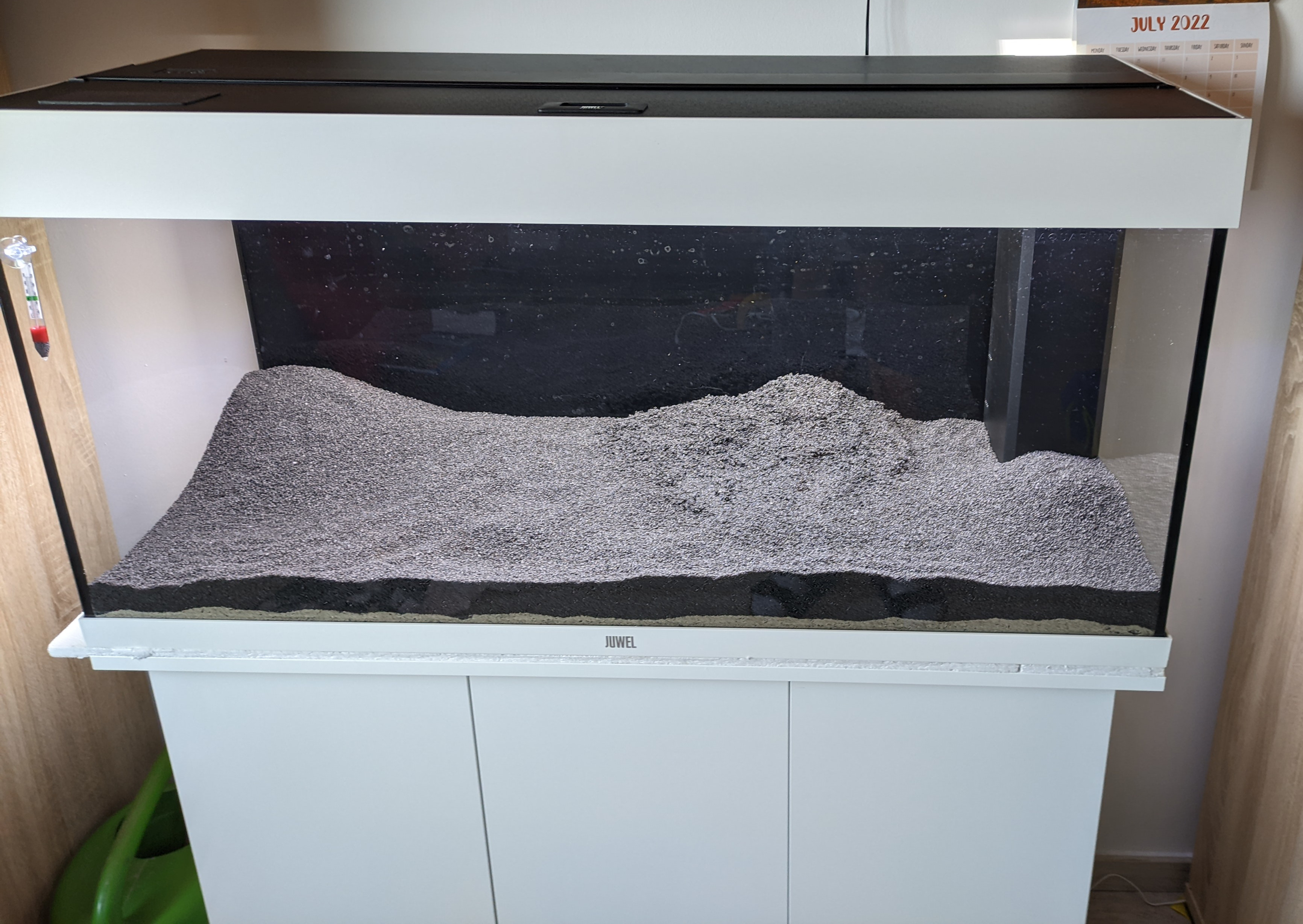 Aquarium filled with gravel and sand